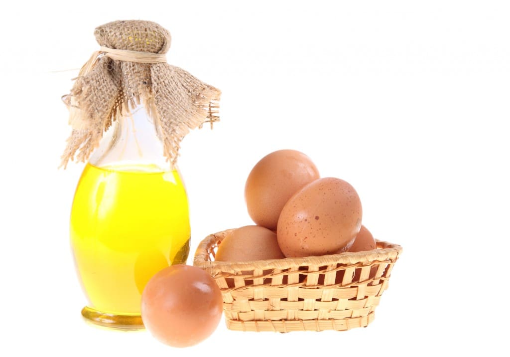 Olive oil and eggs in wattled basket